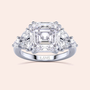 Stunning 14K white gold engagement ring with Asscher-cut diamond center and side pear-shaped diamonds, showcasing luxury and elegance.