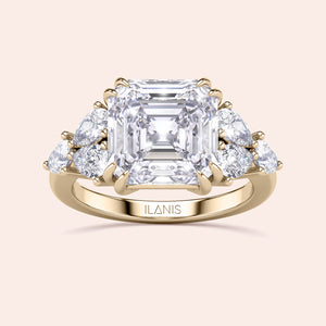 "Elegant yellow gold Asscher cut engagement ring with side stones, available in 14K, 18K, or platinum by Ilanis."
