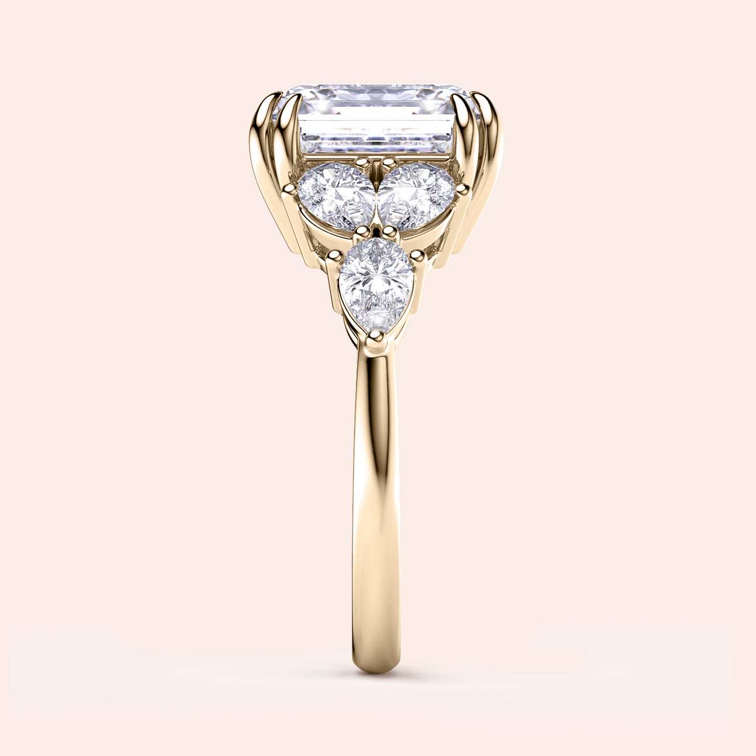 Elegant 14K gold engagement ring featuring asscher and pear-cut side stones in a floral design, set against a beige background.|




#14KRecycledYellowGold
#18KRecycledYellowGold






