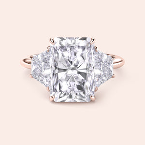 Radiant cut diamond engagement ring in 14K or 18K rose gold, featuring trapezoid side diamonds for a stunning look.