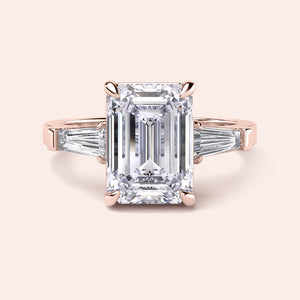 Elegant 14K Rose Gold engagement ring featuring emerald cut and tapered baguette diamonds, perfect for timeless beauty.