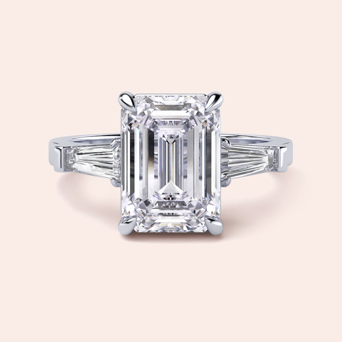 Emerald cut diamond ring in 14K or 18K white gold or platinum with tapered baguette side stones for a stunning engagement.
