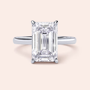 Emerald cut diamond ring in 14K white gold, featuring a classic cathedral setting for an elegant and timeless design.