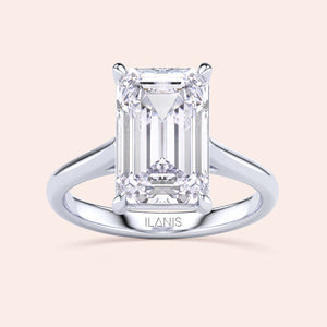 Stunning emerald-cut diamond engagement ring in 14K/18K gold or platinum, by ILANIS, featuring a sleek cathedral setting.