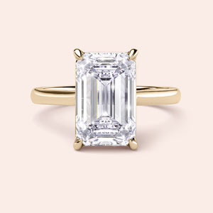 Elegant emerald cut engagement ring in 14K or 18K yellow gold or platinum, showcasing timeless sophistication.