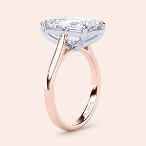 Two-tone 14K/18K white and rose gold emerald-cut diamond solitaire engagement ring. Elegant cathedral design. 