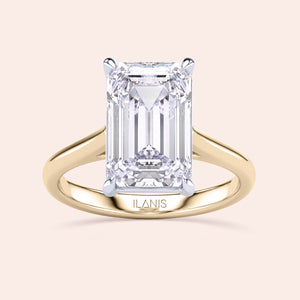 Emerald-cut two-tone 14K white and yellow gold diamond ring, featuring a stunning solitaire design in a cathedral setting. 