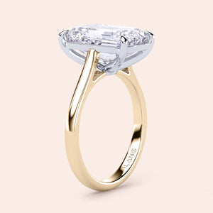 Two-tone 14K gold engagement ring featuring an elongated cushion-cut diamond in white and yellow gold design. 
