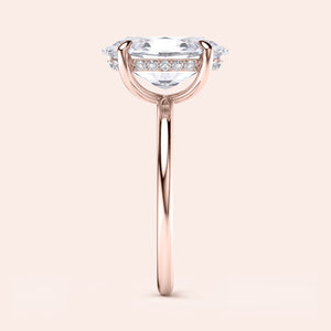 Elegant rose gold engagement ring featuring an oval solitaire diamond, available in 14K, 18K, or platinum. Timeless beauty.