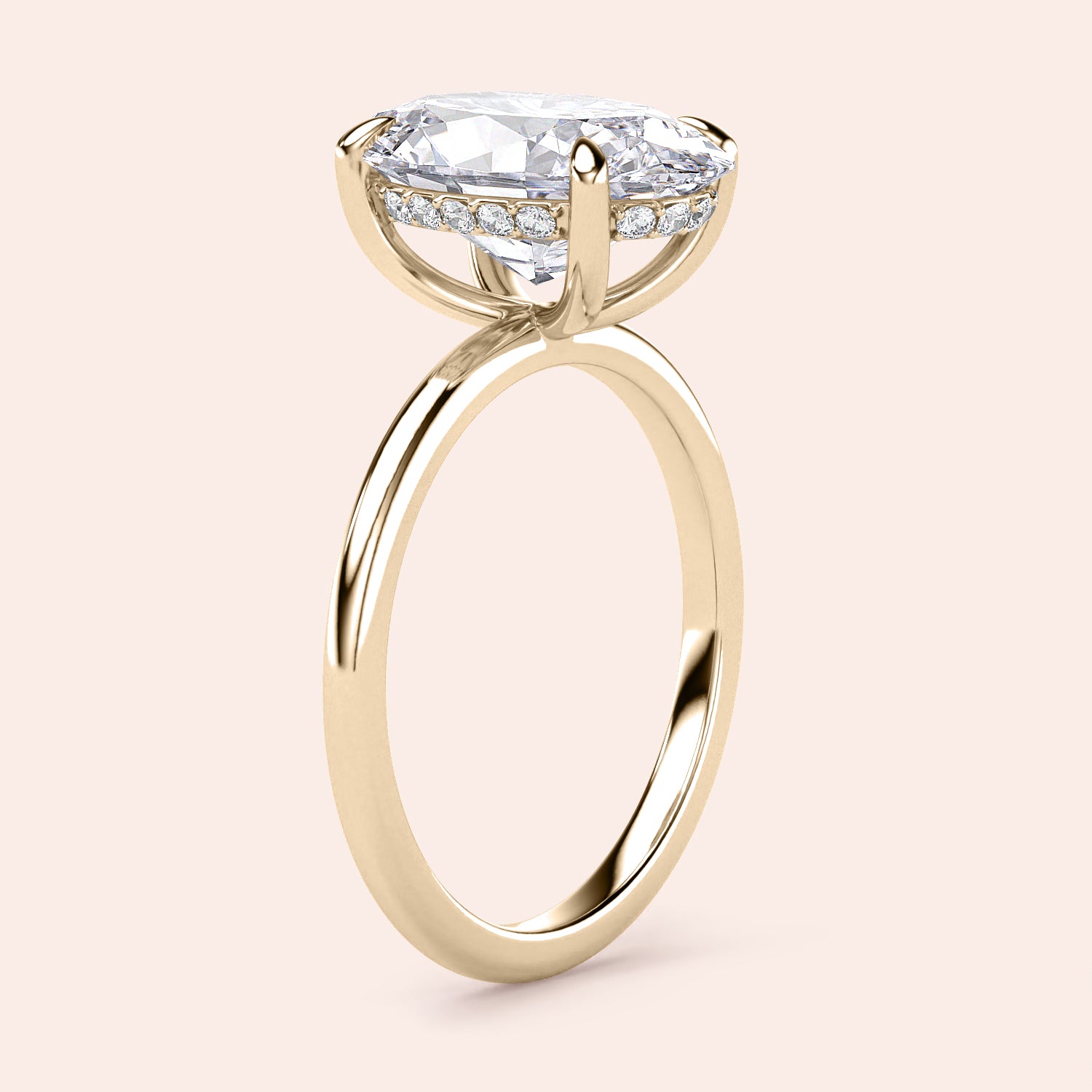 Elegant 14K Gold Engagement Ring with Oval Solitaire and Hidden Halo, displayed on a soft beige background.|




#14KRecycledYellowGold
#18KRecycledYellowGold





