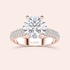 Elegant rose gold round-cut diamond engagement ring with pave-set band in 14K or 18K gold or platinum, exuding luxury and sophistication.