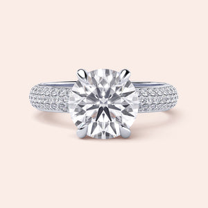 Elegant round diamond engagement ring withPave-set band in 14K, 18K, or platinum. Perfect for a timeless proposal.