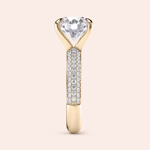 Elegant yellow gold engagement ring featuring a heart-shaped diamond center stone and sparkling round diamonds in a three-row design.