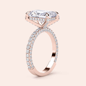 Elegant 14K rose gold engagement ring featuring a radiant-cut diamond and sparklingPave band. Not worn on model.