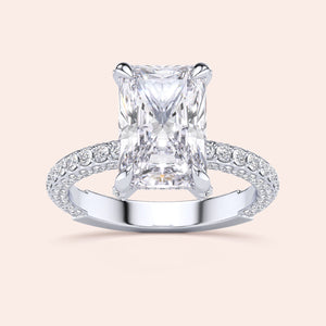 Radiant-cut diamond engagement ring in 14K or 18K white gold, showcasing a stunning pave diamond band detail.