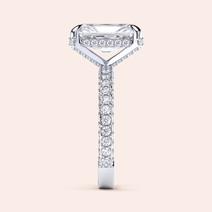 Elegant 14K/18K platinum engagement ring with emerald-cut diamond, side view showcasing a radiantPave diamond band.