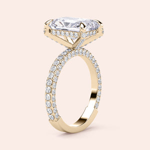 Elegant 14K or 18K gold ring with radiant elongated cushion-cut diamond and pave band, perfect for engagement.