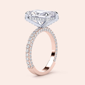 Two-tone 14K white and rose gold diamond ring featuring an emerald-cut stone, perfect for stylish weddings or engagements. 