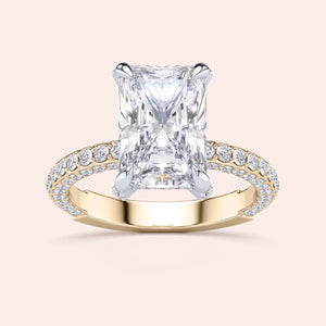 Two-tone 14K/18K white and yellow gold engagement ring with emerald-cut diamond and hidden halo design. 