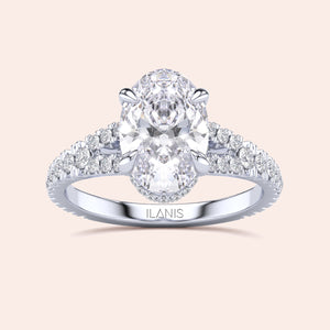 Elegant oval diamond engagement ring in 14K or 18K gold or platinum, featuring a double row ofPave diamonds on a neutral background.