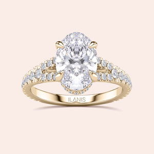 Elegant 14K yellow gold oval diamond engagement ring with pave-set diamonds, crafted by Ilanis Jewelry.