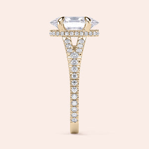 14K gold engagement ring featuring a sleek marquise-cut diamond center withPave-set diamonds on the band, side view.