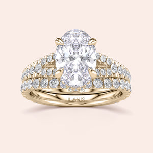 Luxurious oval-shaped diamond engagement ring set in a 14K or 18K gold band, adorned with smaller sparkling diamonds.