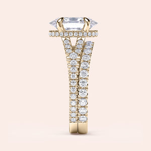 "Elegant oval engagement ring in 14K or 18K yellow gold, featuring a hidden halo and split shank design with brilliant-cut diamonds."