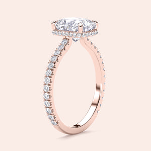 Elegant rose gold engagement ring featuring a cushion-cut diamond, halo accents, and diamond-paved band in 14K/18K or platinum.