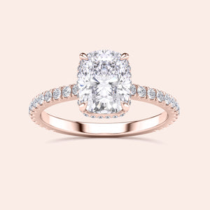 Elegant rose gold engagement ring featuring cushion cut diamond center stone and pave-set diamonds, available in 14K, 18K, or platinum.