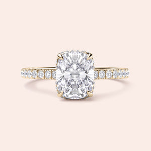 Elegant 14K yellow gold cushion-cut diamond engagement ring withPave band detailing and delicate claw prongs.