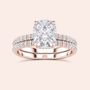 Elegant rose gold diamond ring set with cushion-cut centerpiece and accent diamonds, available in 14K, 18K, or platinum options.