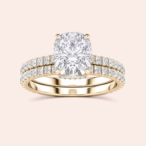 Elegant yellow gold engagement ring featuring a cushion-cut diamond andPave band, available in 14K, 18K, and platinum options.
