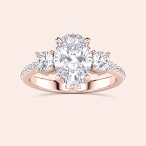 Elegant oval-shaped diamond engagement ring with side stones in rose gold, available in 14K, 18K, or platinum. Exquisite fine jewelry.