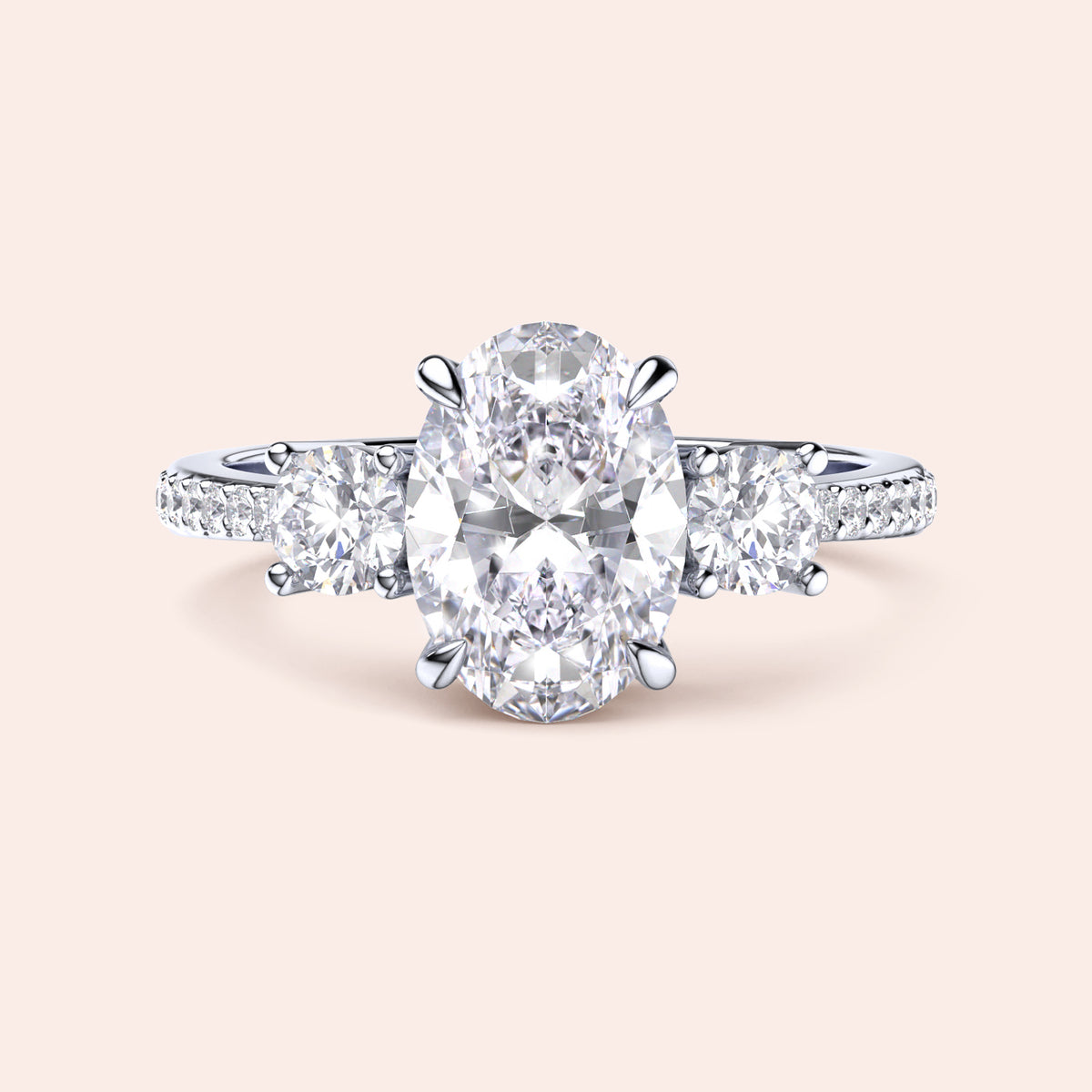 Elegant three-stone engagement ring in 14K/18K gold or platinum, featuring an oval diamond and sparkling side stones.