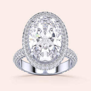 Stunning oval-shaped diamond engagement ring withPave-set diamonds on a 14K or 18K gold or platinum band. Not worn on model.