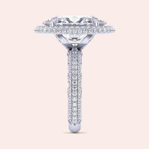 Elegant 14K/18K white gold ring featuring a radiant-cut diamond with a halo of pave-set diamonds, perfect for engagements.