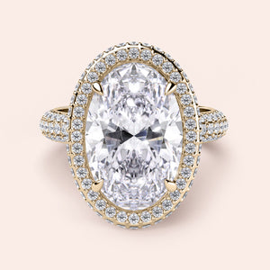 Luxurious 14K or 18K yellow gold engagement ring with oval diamond and halo of smaller diamonds, perfect for your special moment.