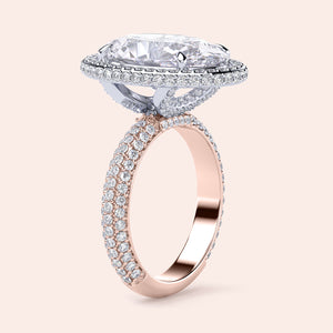 Two-tone 14K white and rose gold oval diamond engagement ring with halo design and pave detailing. Perfect for love! 