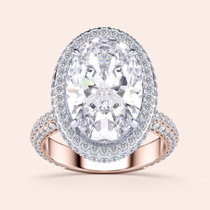 Two-tone oval diamond ring in 14K/18K white and rose gold, featuring a double-edge halo design, perfect for engagements. 