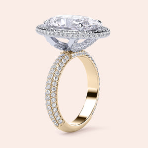 Two-tone 14K/18K white and yellow gold oval diamond engagement ring with a double-edge halo and 3D pave design. 