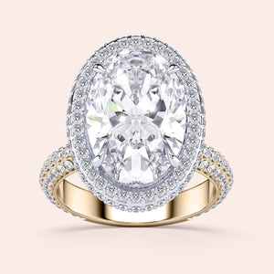 Two-tone 14K/18K white and yellow gold oval diamond ring with double edge halo, perfect for engagement. 