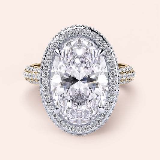 Two-tone 14K white and yellow gold oval diamond engagement ring with double-edge halo and 3D pave detail. 