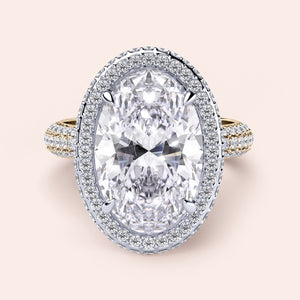 Two-tone 14K white and yellow gold oval diamond engagement ring with double-edge halo and 3D pave detail. 