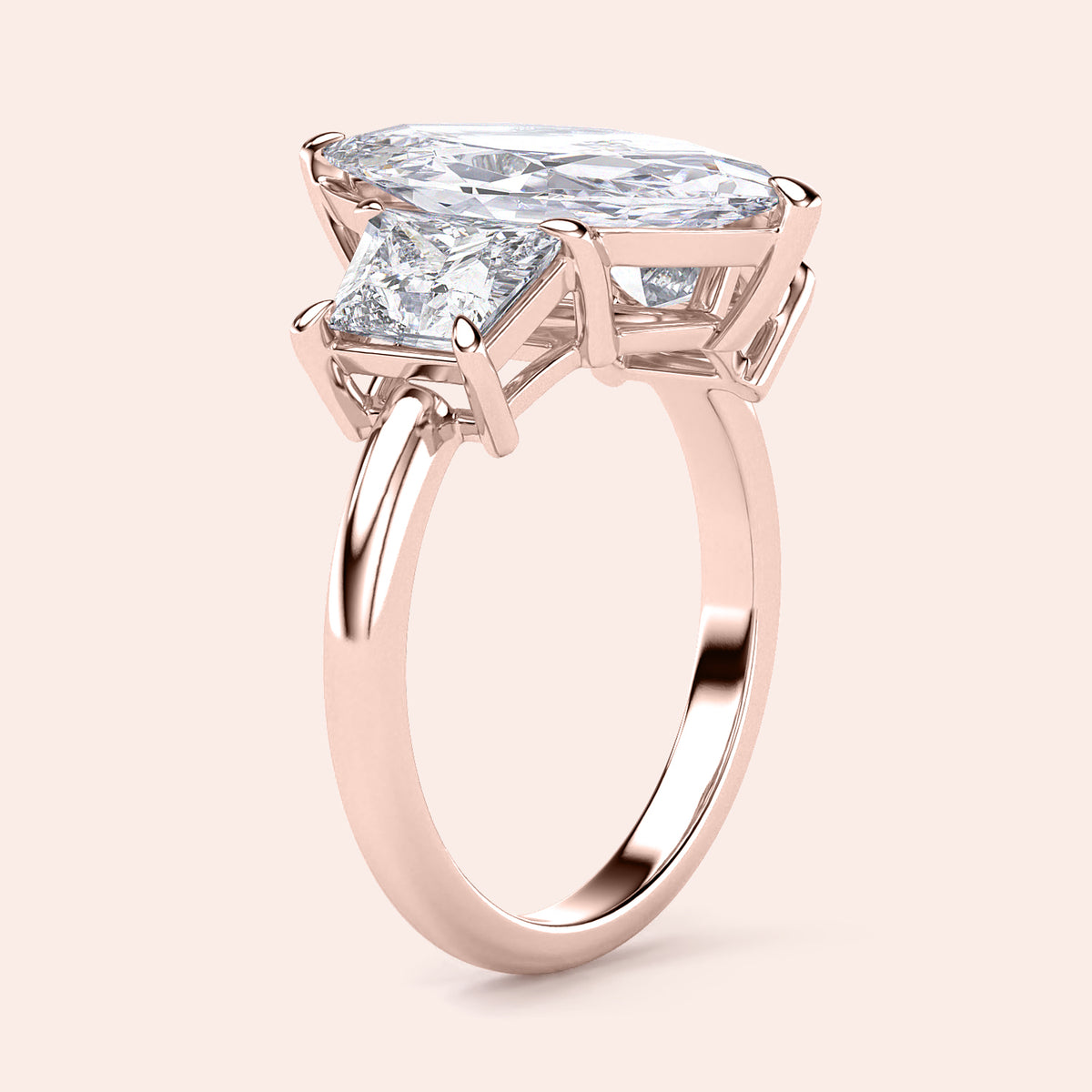 Luxurious 14K rose gold engagement ring featuring a marquise three-stone design with jade and elegant trapezoid accents.