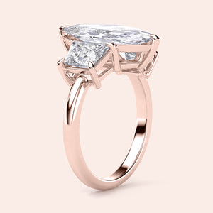 Luxurious 14K rose gold engagement ring featuring a marquise three-stone design with jade and elegant trapezoid accents.