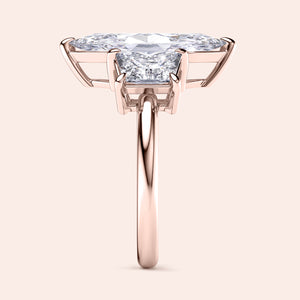 Elegant 14K rose gold engagement ring featuring a jade marquise cut and three trapezoid stones, perfect for timeless romance.