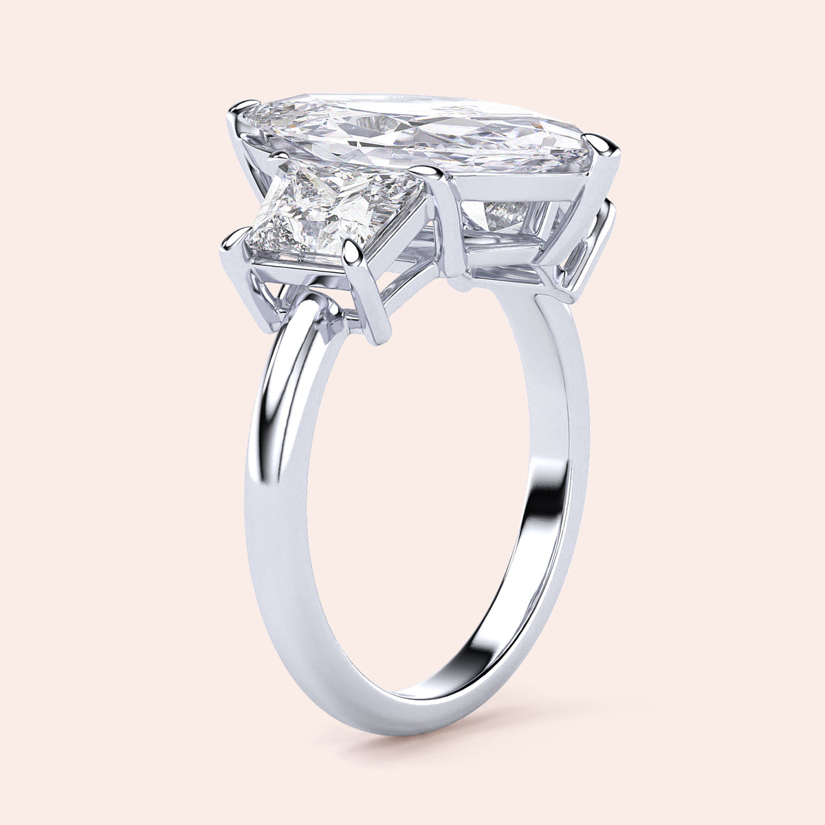 "Elegant 14K gold engagement ring featuring a marquise jade and three stone trapezoid diamonds in a secure setting."