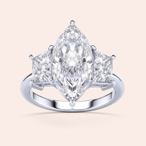 Elegant marquise cut diamond engagement ring with side diamonds in 14K/18K gold or platinum, shining brilliantly against light.