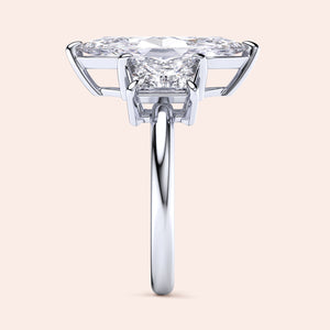 "Elegant 14K white gold engagement ring featuring a marquise-cut jade and three trapezoid stones in a stunning design."